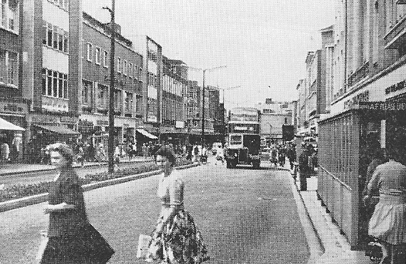 Fig. 218 Exeter. The High Street as reconstructed after war-damage to standard dual carriageway form.