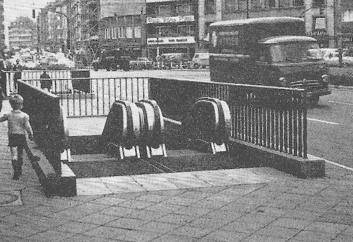 Fig. 225 An interesting feature of German reconstruction is the use of escalators in the open air. This example from Dusseldorf gives access to a pedestrian subway under a busy road.