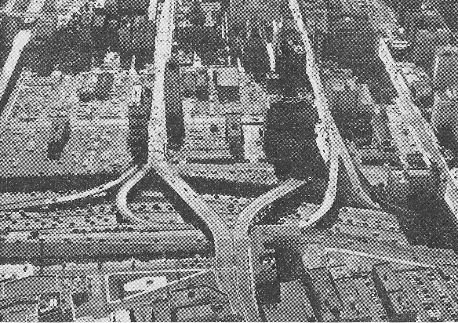 Fig. 238 Los Angeles. The Harbor Freeway skirting the downtown area. The disintegration of the downtown area into open parking lots is clearly visible.