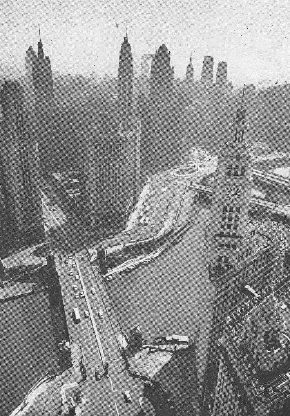 Fig. 246 ‘…down town areas of such intrinsic power and character that they have retained their magnetism.’ (Chicago. Bordering the far side of the river there is another wide highway underneath the road visible in the photograph).